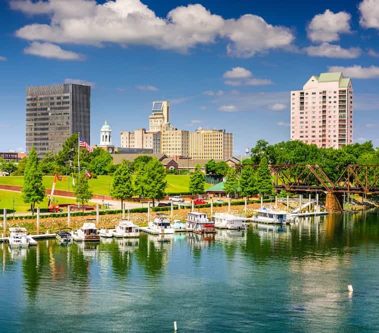 boats on a dock with buildings in the background