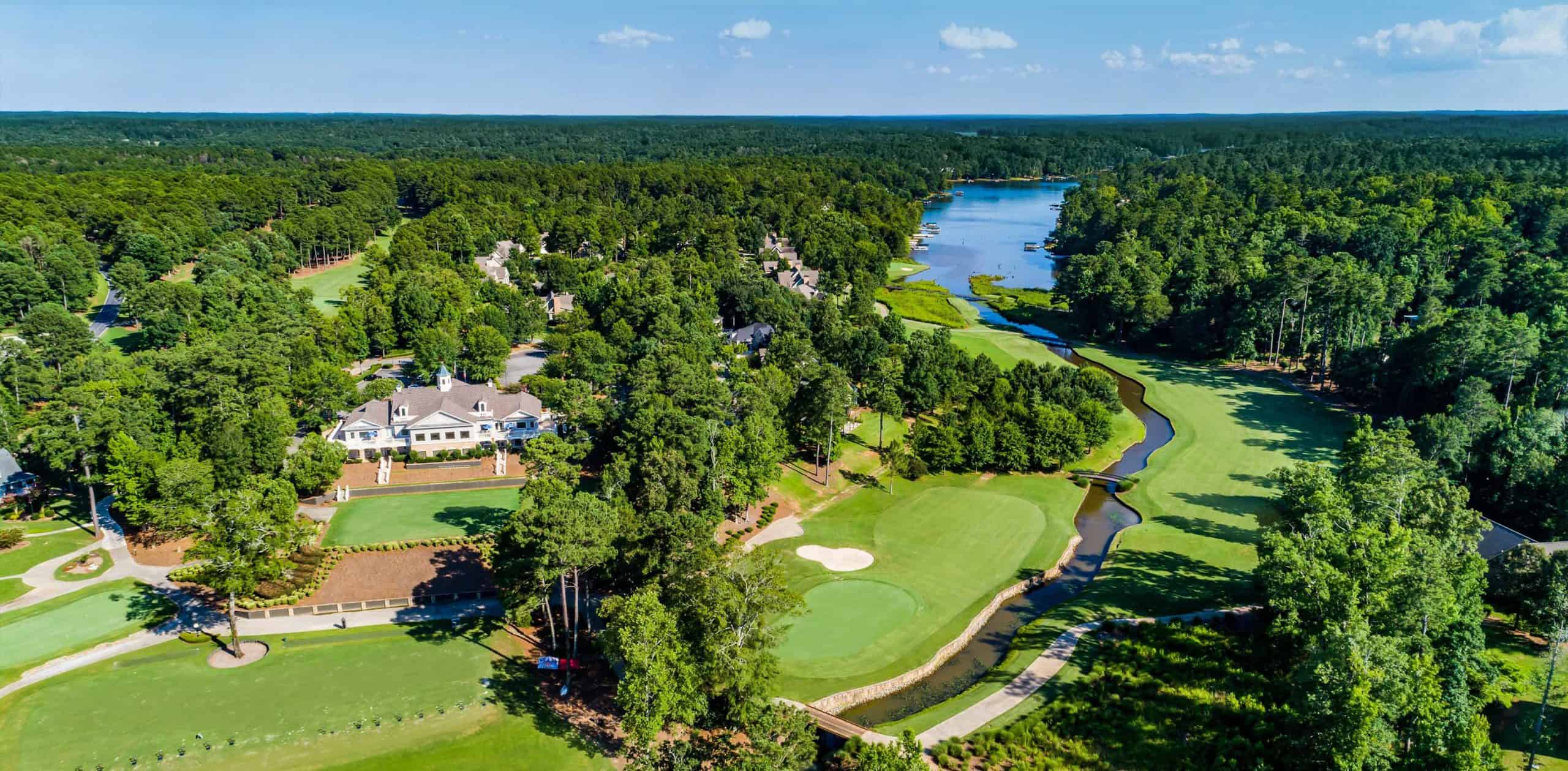 aerial view of a golf course and neighborhood