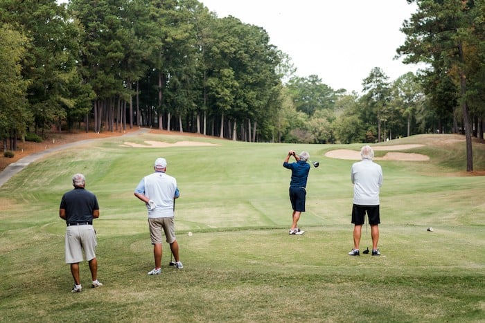 people on golf course
