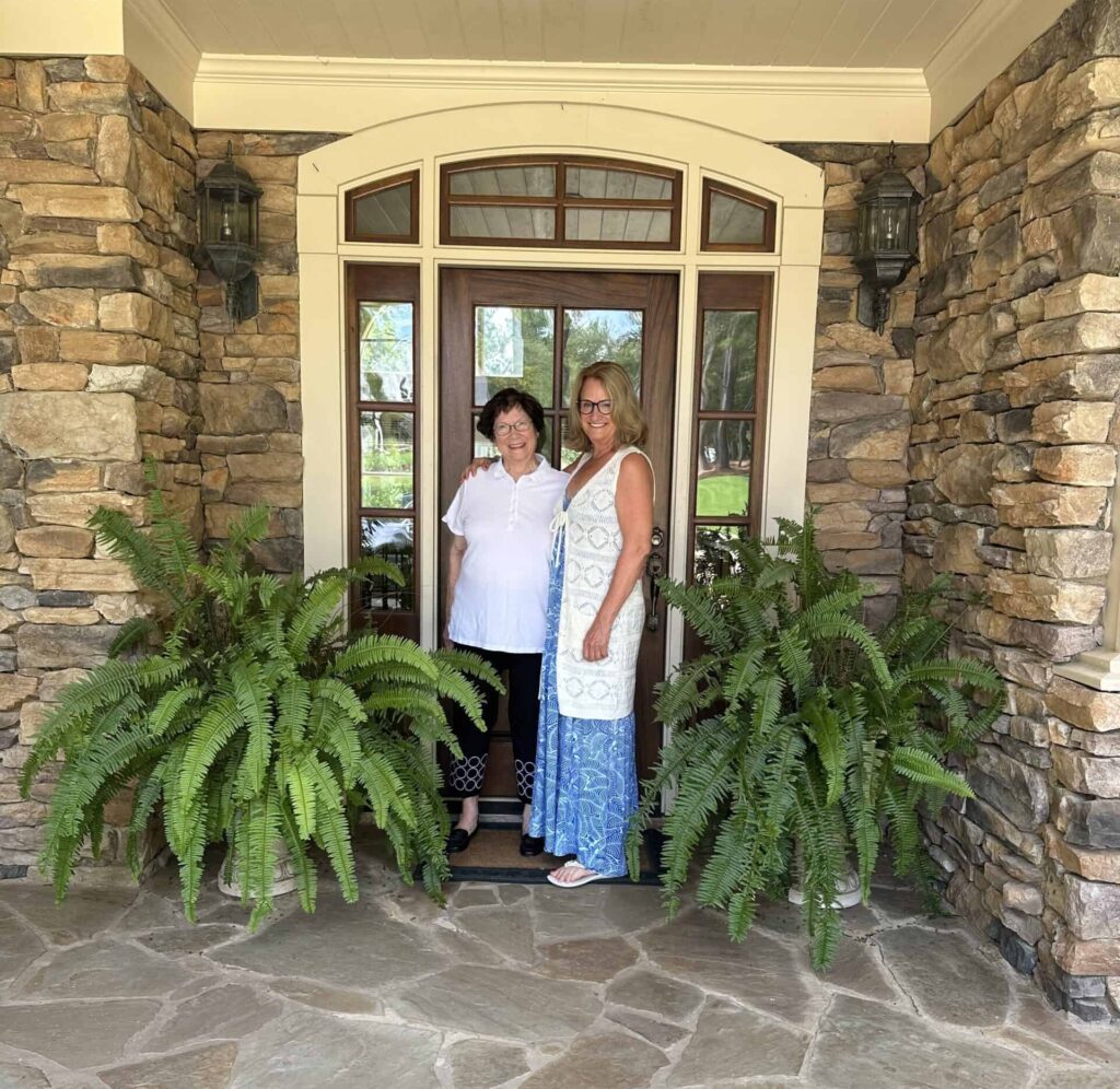Harbor Club real estate sales director Kathy Phillips with long-term resident Louise Hull