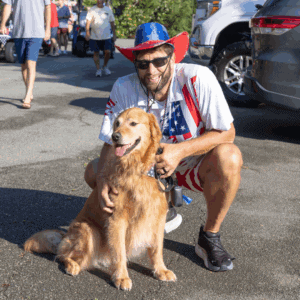 Sweet dog and owner at Harbor Club's Fourth of July Cart Parade